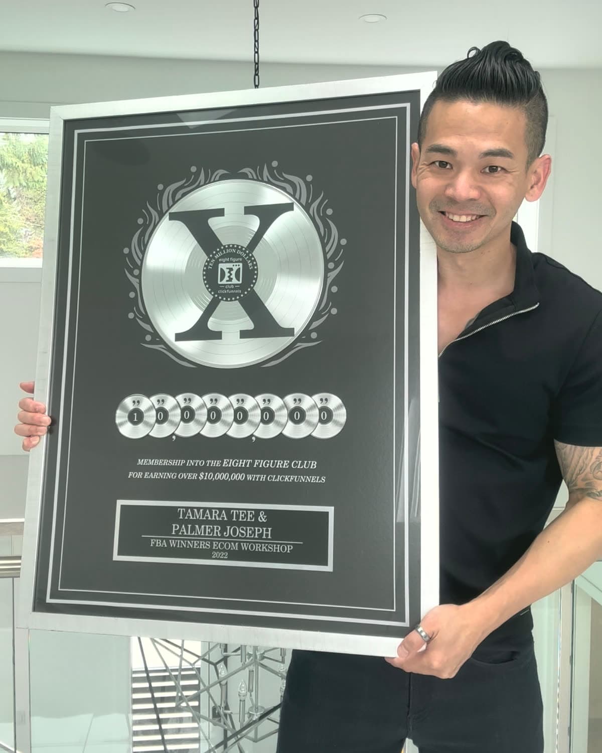 Palmer Joseph holding the ClickFunnels 2CCX Eight Figure Award for earning over $10,000,000